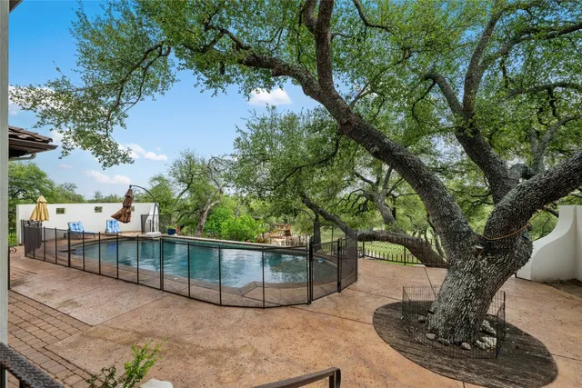 a living room with furniture a fireplace and a chandelier