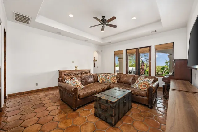 a bedroom with a bed and flat screen tv