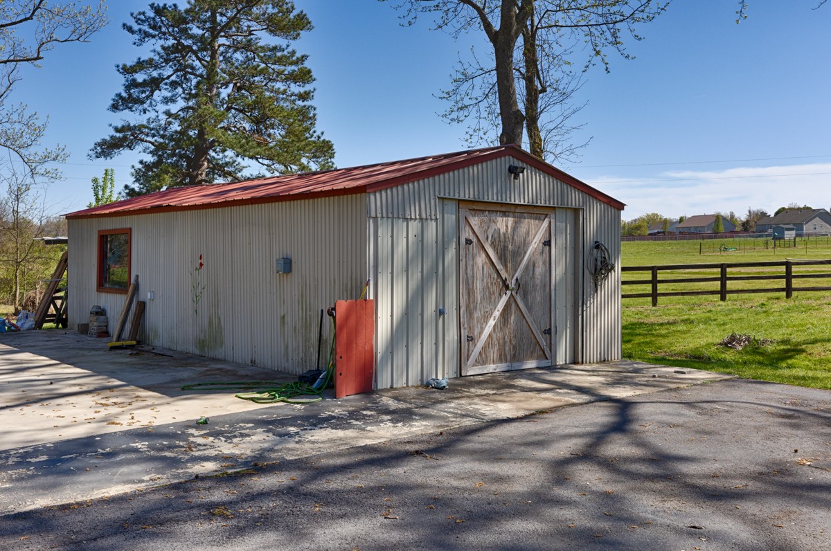 24 Slaughter Pen Road Ardmore, TN 38449 - Photo 25 of 32 a front view of a house with a yard