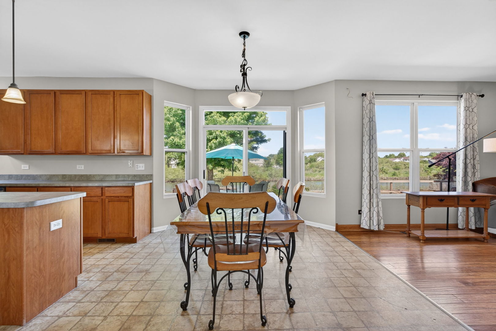 25204 Spring Street Manhattan, IL 60442 - Photo 11 of 34 a dining room with furniture window wooden floor