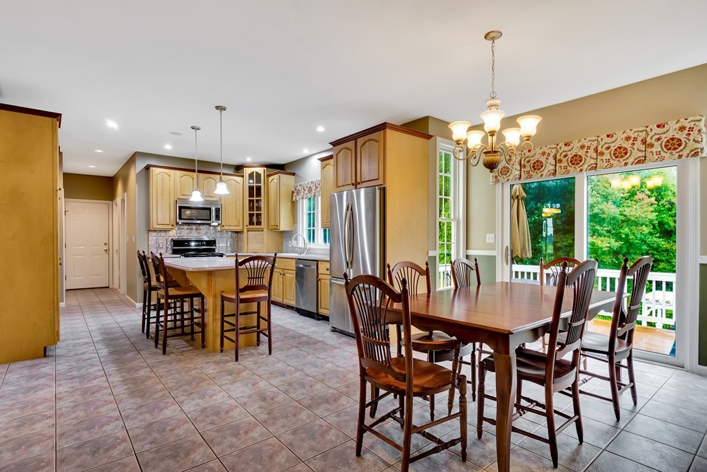 11 Pennock Road Ashland, MA 01721 - Photo 8 of 30 a view of a dining room with furniture window and outside view