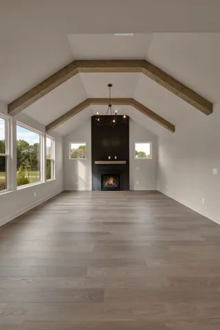 a view of a livingroom with furniture window and wooden floor