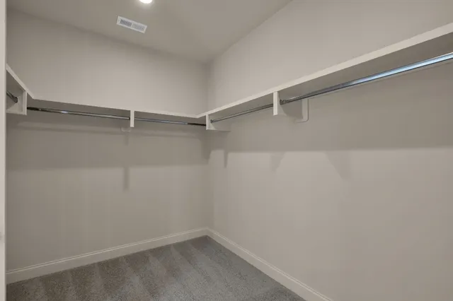 a view of a room with shelf on the wall