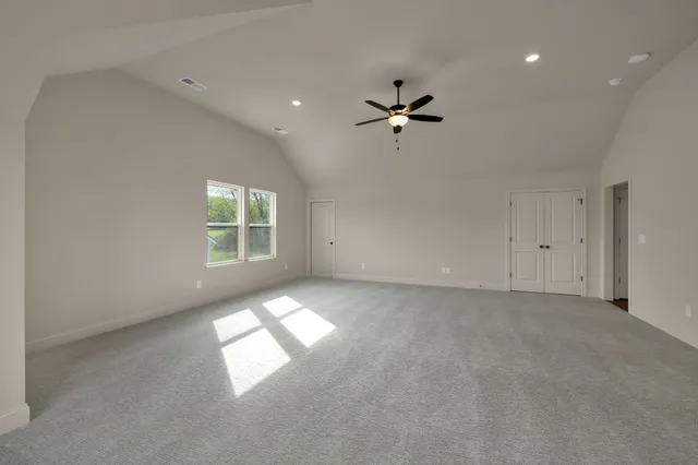 a view of empty room with windows