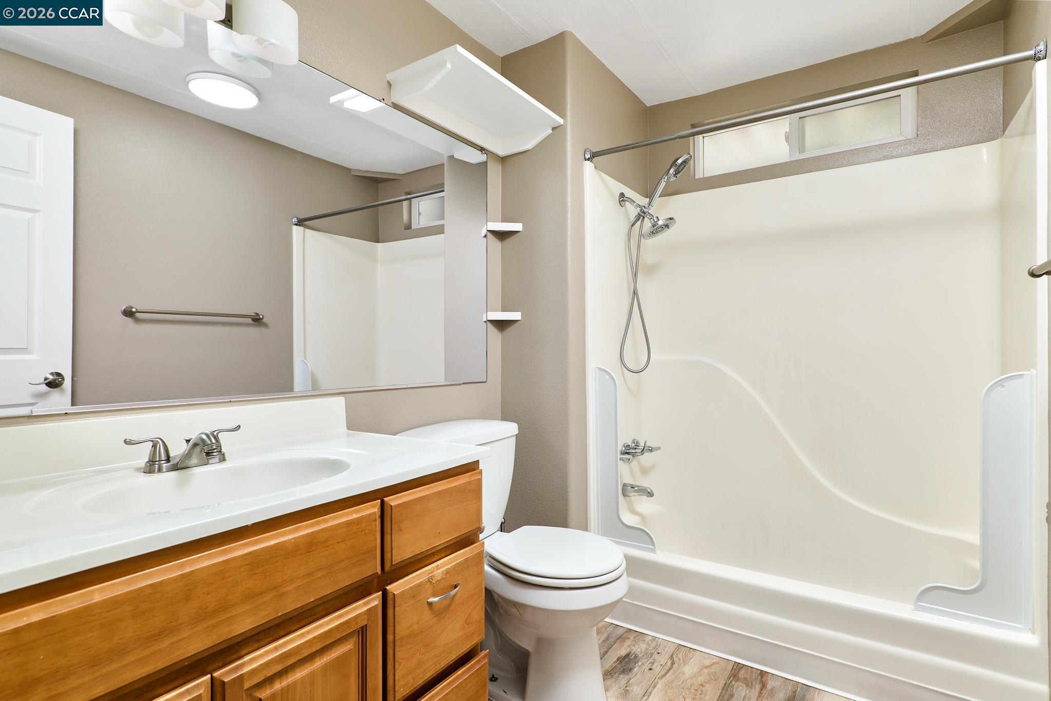 16711 Marsh Creek Road, Unit 112 Clayton, CA 94517 - Photo 15 of 27 a bathroom with a sink a toilet and shower