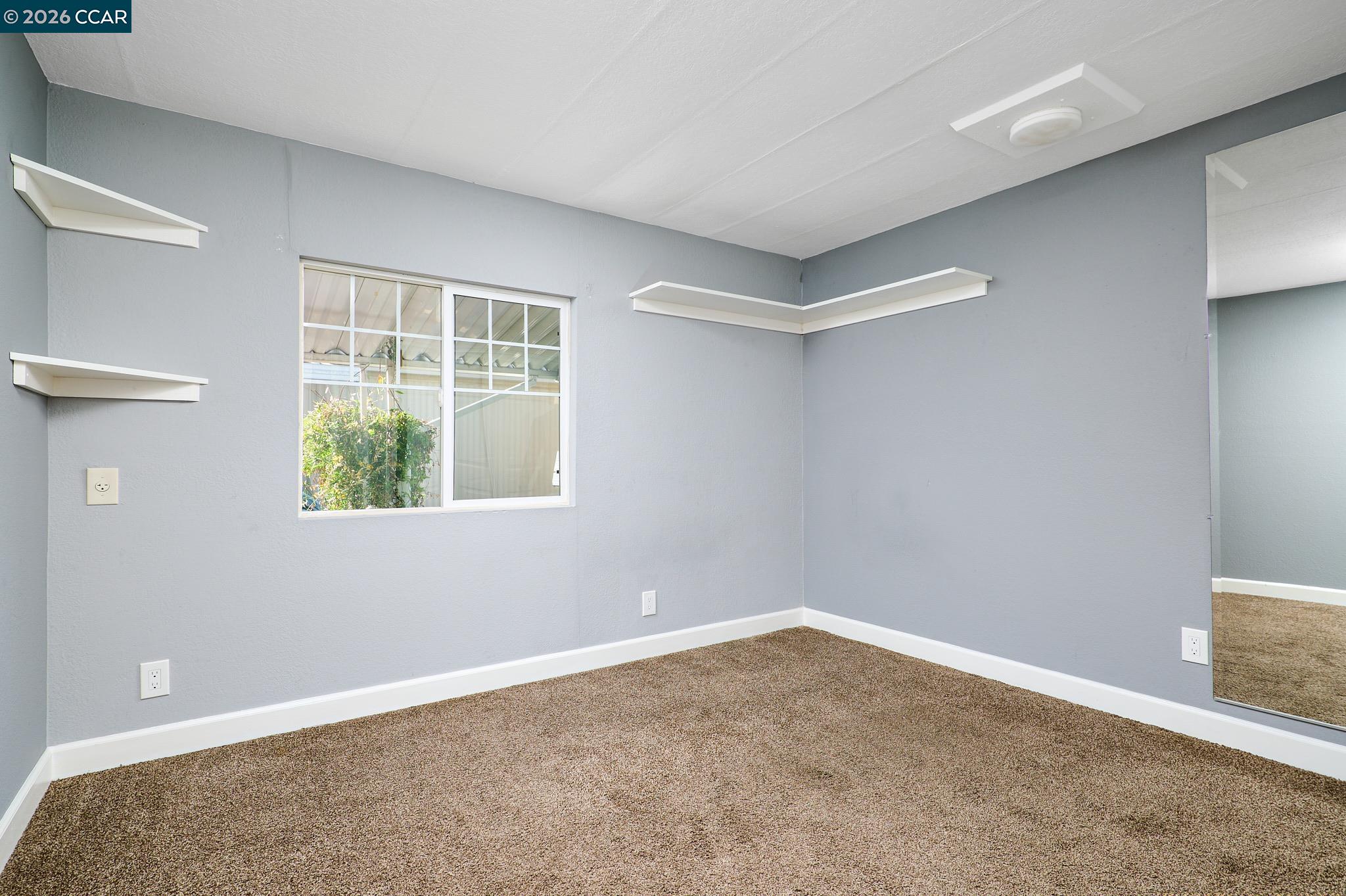 16711 Marsh Creek Road, Unit 112 Clayton, CA 94517 - Photo 16 of 27 a view of an empty room with a window