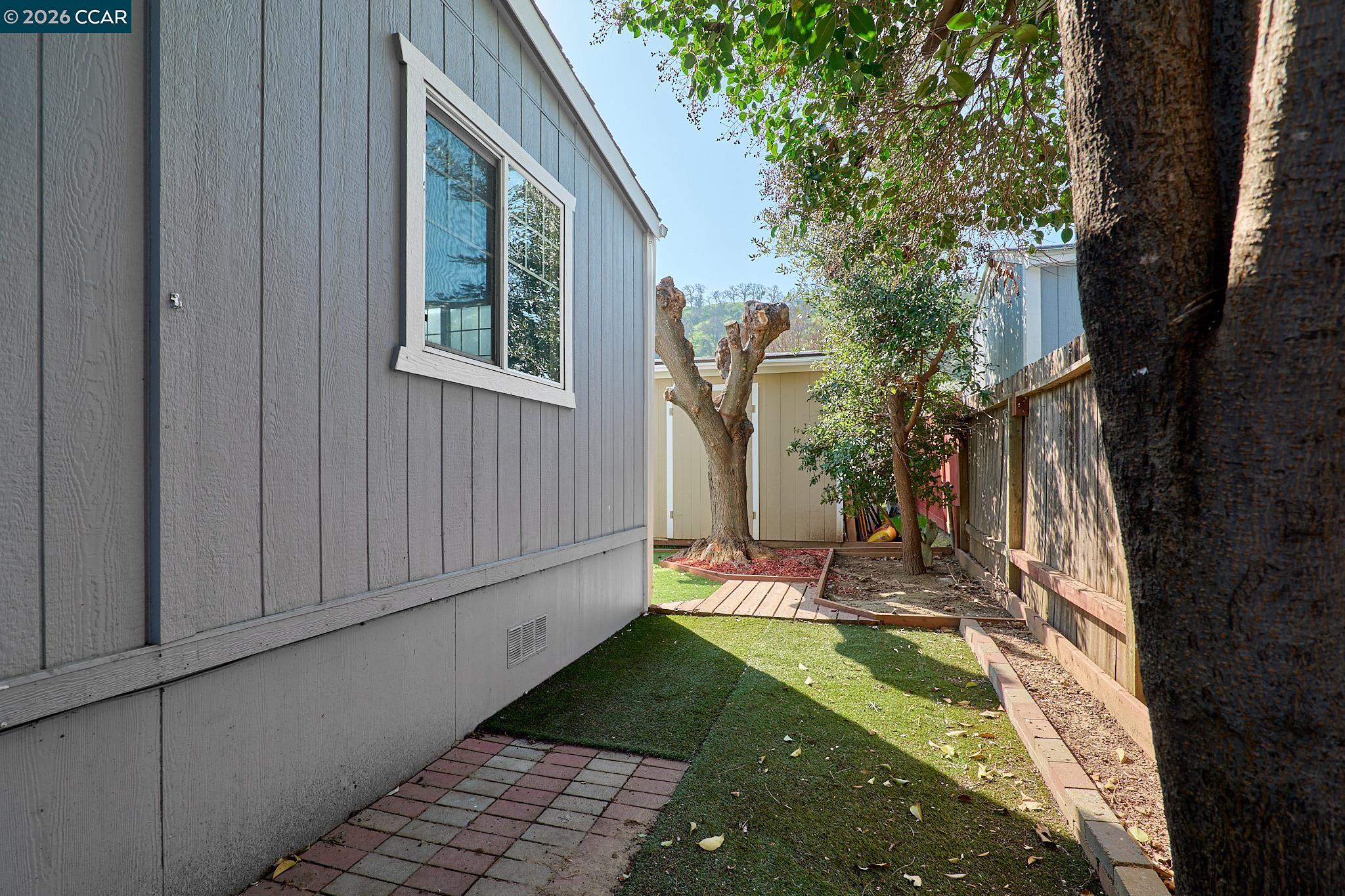 16711 Marsh Creek Road, Unit 112 Clayton, CA 94517 - Photo 24 of 27 a view of a backyard with sitting area