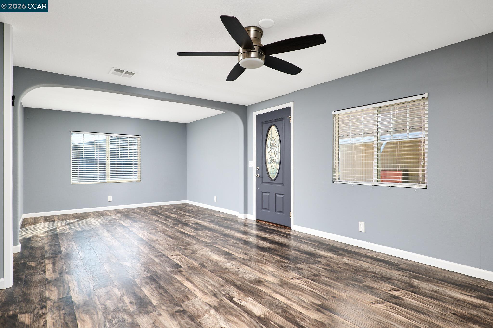 16711 Marsh Creek Road, Unit 112 Clayton, CA 94517 - Photo 7 of 27 a view of empty room with wooden floor and fan