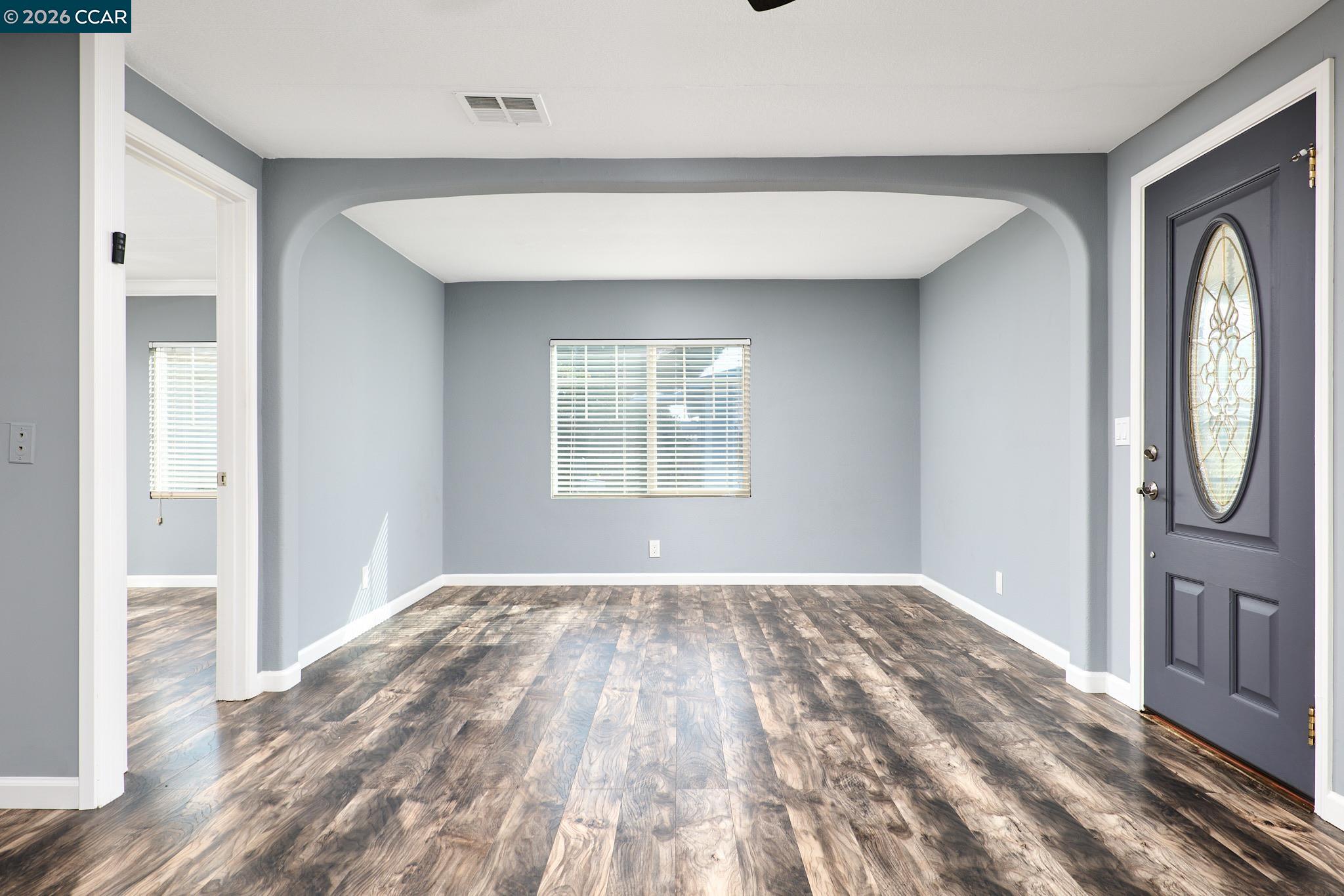 16711 Marsh Creek Road, Unit 112 Clayton, CA 94517 - Photo 8 of 27 a view of empty room with wooden floor and fan