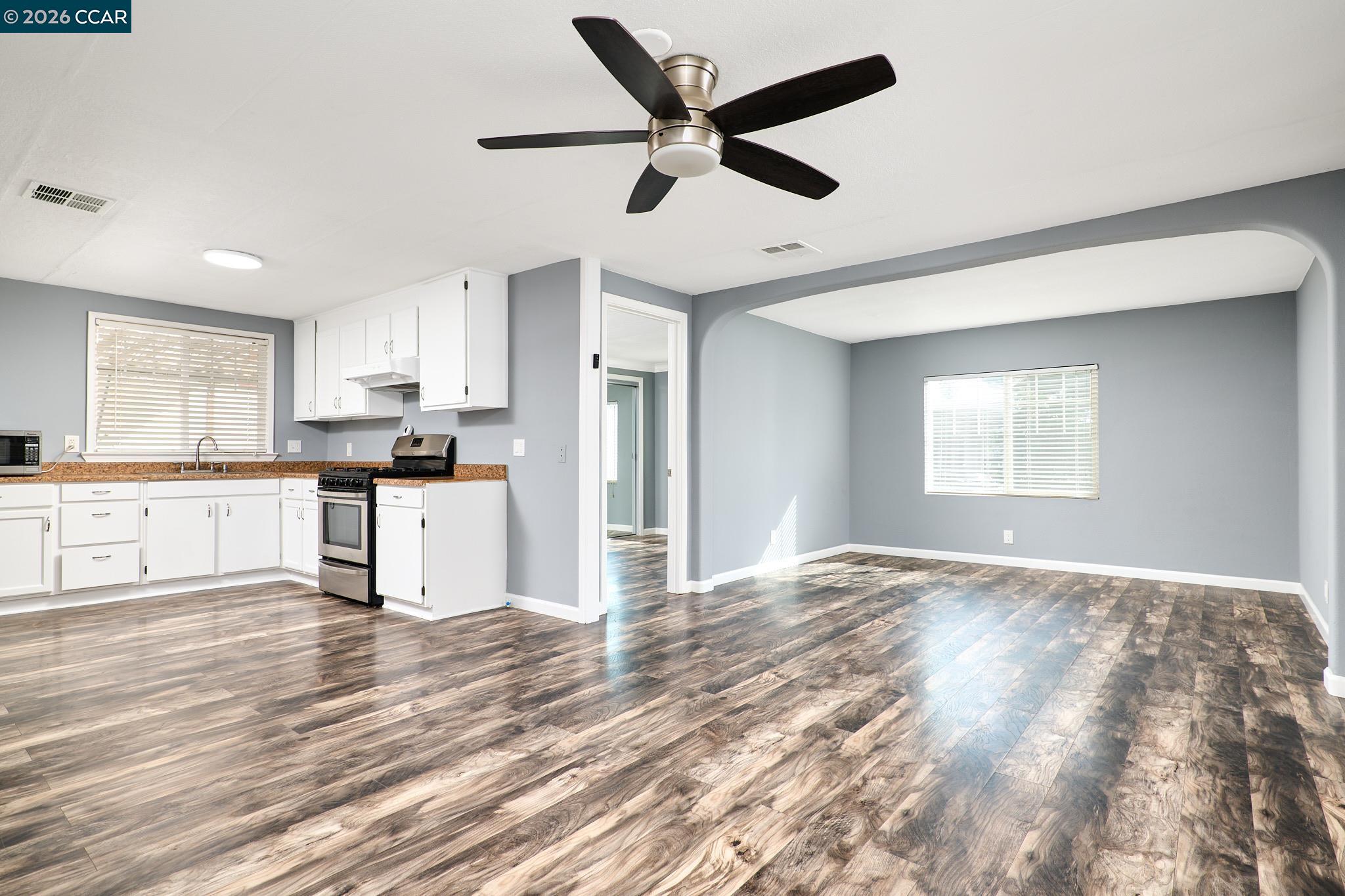 16711 Marsh Creek Road, Unit 112 Clayton, CA 94517 - Photo 10 of 27 a view of a kitchen with wooden floor and a window