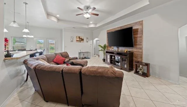 a living room with furniture and a flat screen tv