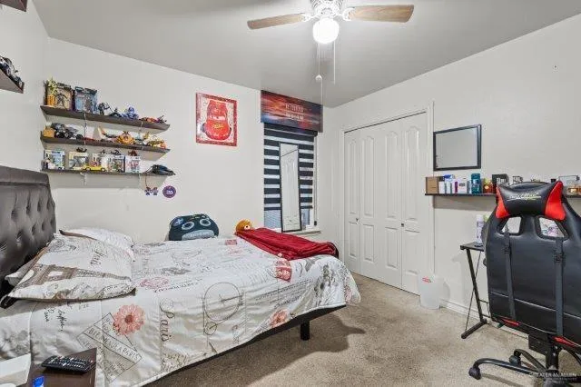 a bedroom with a bed and cabinets