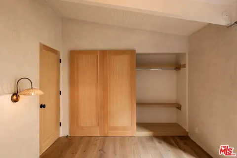 a bathroom with double sink and a mirror