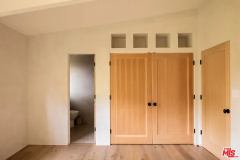 a view of a balcony with wooden floor