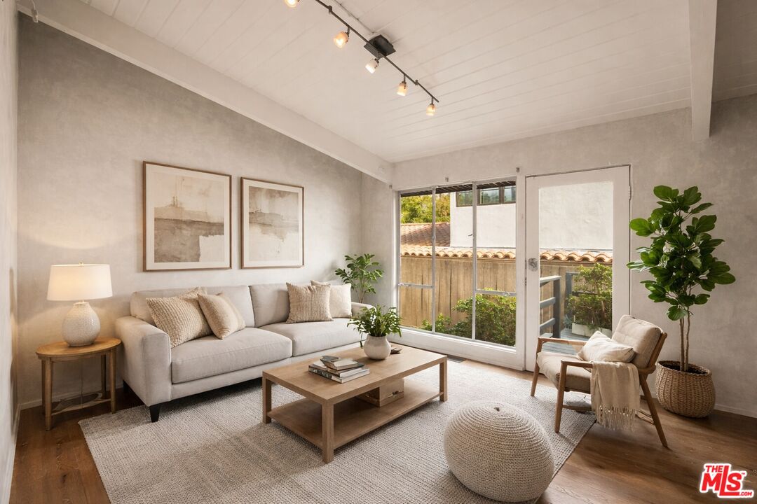 295 Mabery Road Santa Monica, CA 90402 - Photo 29 of 49 a living room with furniture and a large window
