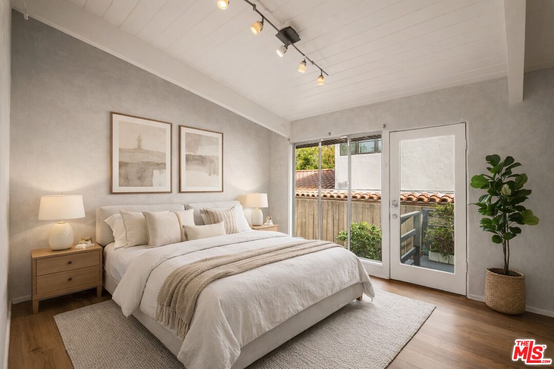 295 Mabery Road Santa Monica, CA 90402 - Photo 30 of 49 a bedroom with a large bed and a large window with outer view