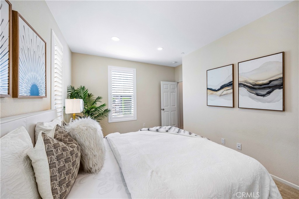 130 Prospect Irvine, CA 92618 - Photo 14 of 35 a bedroom with a large bed and a painting on the wall