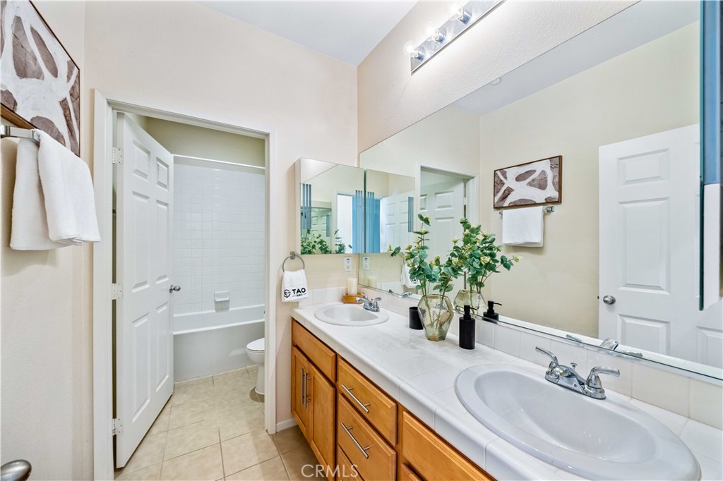 130 Prospect Irvine, CA 92618 - Photo 17 of 35 a bathroom with a double vanity sink mirror and toilet