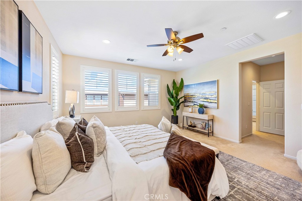 130 Prospect Irvine, CA 92618 - Photo 20 of 35 a bedroom with a large bed and a chandelier