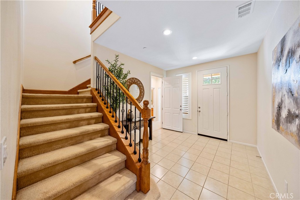 130 Prospect Irvine, CA 92618 - Photo 3 of 35 a view of entryway with wooden floor and stairs