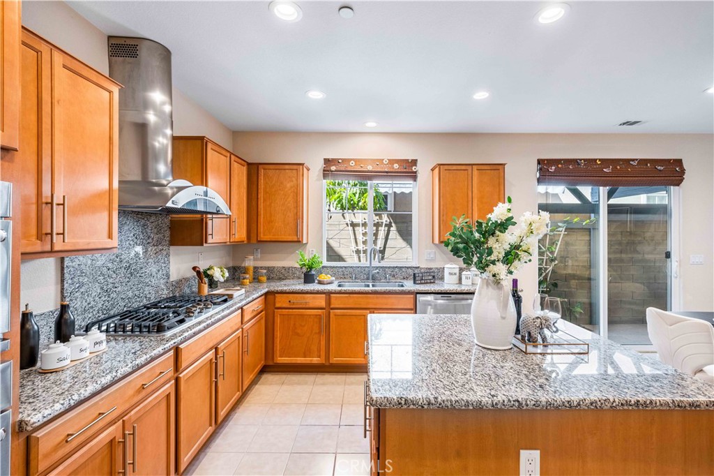 130 Prospect Irvine, CA 92618 - Photo 8 of 35 a kitchen with granite countertop a sink and a stove