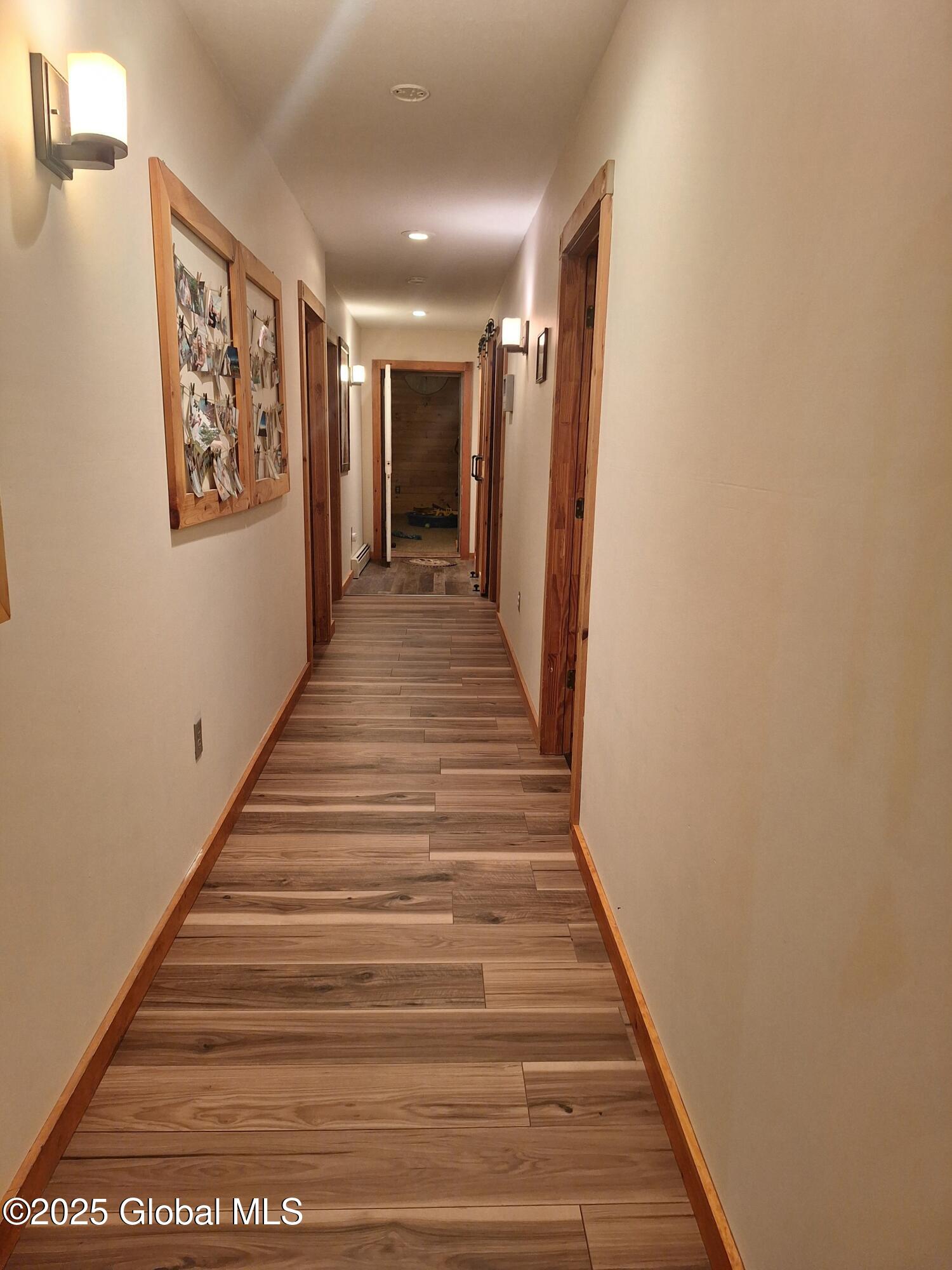 117 Hartman Road Hudson Falls, NY 12839 - Photo 22 of 49 Wide hallway new laminate