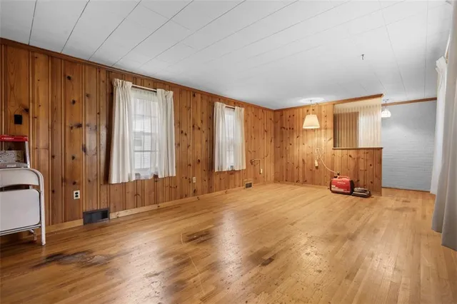 a view of a livingroom with a furniture and windows