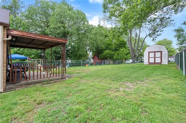 a view of a backyard with a small cabin