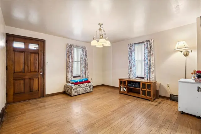 a bedroom with furniture and window