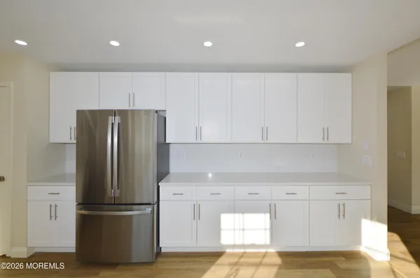 a view of room with window and hardwood floor