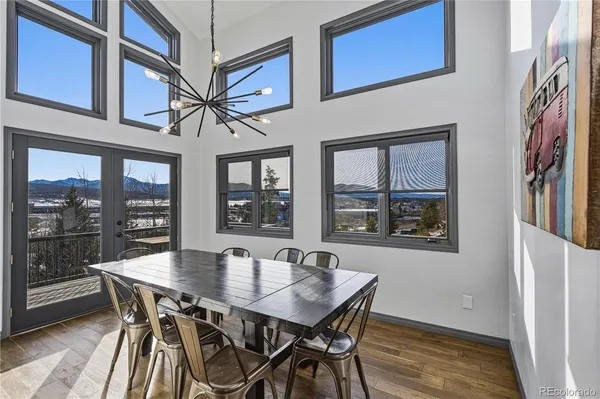 a view of a dining room with furniture window and wooden floor