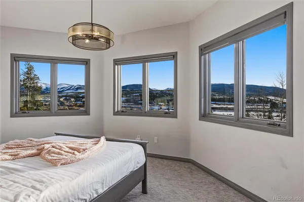 a bedroom with bed and a window