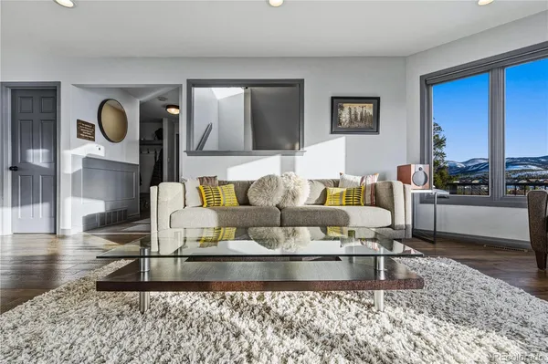 a living room with furniture and a rug