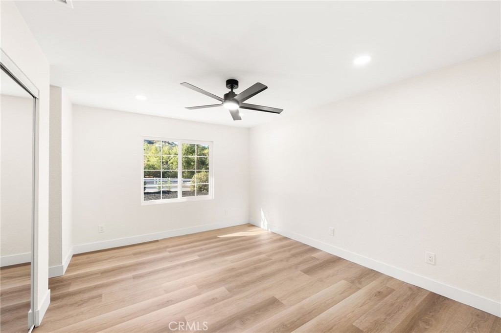 2060 South Grade Road Alpine, CA 91901 - Photo 19 of 69 a view of a ceiling fan and wooden floor