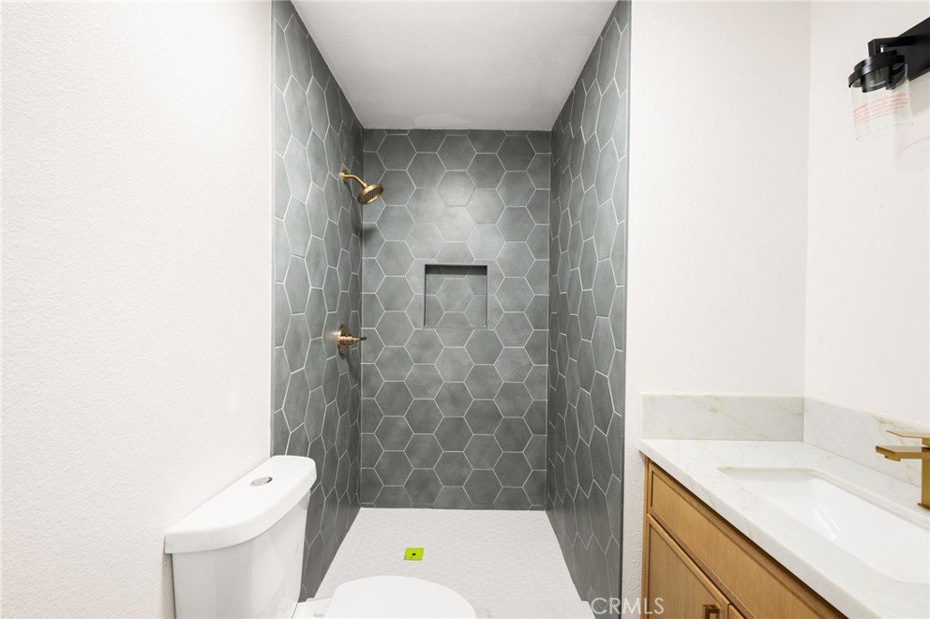 2060 South Grade Road Alpine, CA 91901 - Photo 23 of 69 a bathroom with a sink a toilet and shower