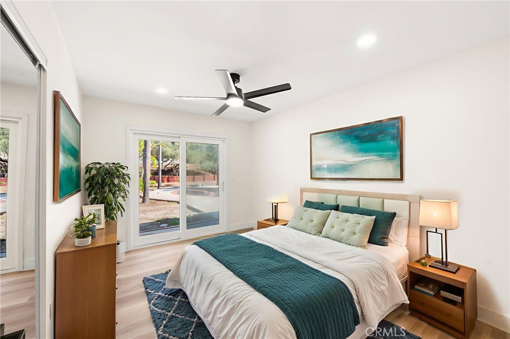 2060 South Grade Road Alpine, CA 91901 - Photo 27 of 69 a bedroom with a large bed and a chandelier