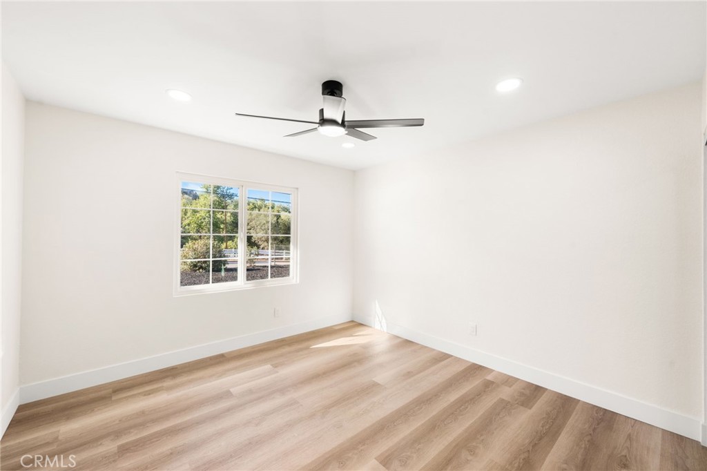 2060 South Grade Road Alpine, CA 91901 - Photo 28 of 69 an empty room with a window and a ceiling fan