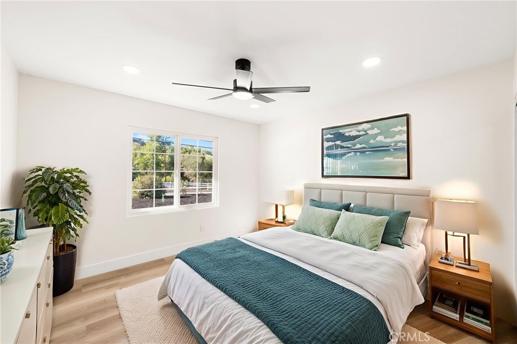 2060 South Grade Road Alpine, CA 91901 - Photo 29 of 69 a bedroom with a bed and a chandelier