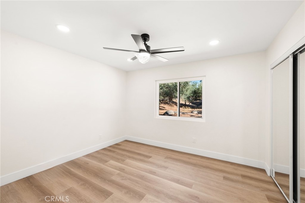 2060 South Grade Road Alpine, CA 91901 - Photo 32 of 69 an empty room with a window and a ceiling fan