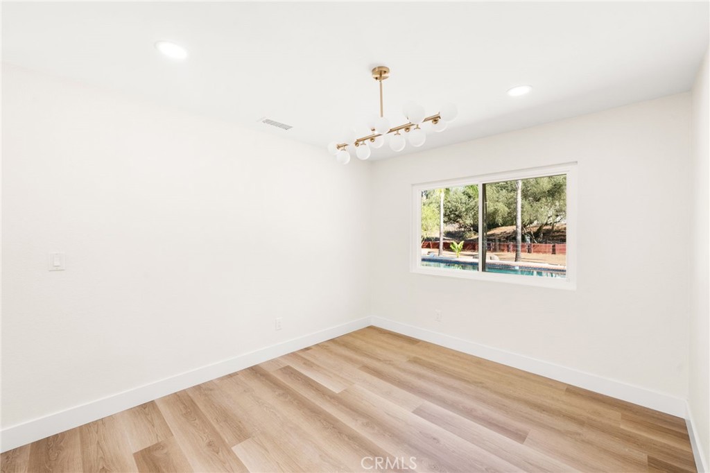 2060 South Grade Road Alpine, CA 91901 - Photo 35 of 69 a view of an empty room with wooden floor and a window