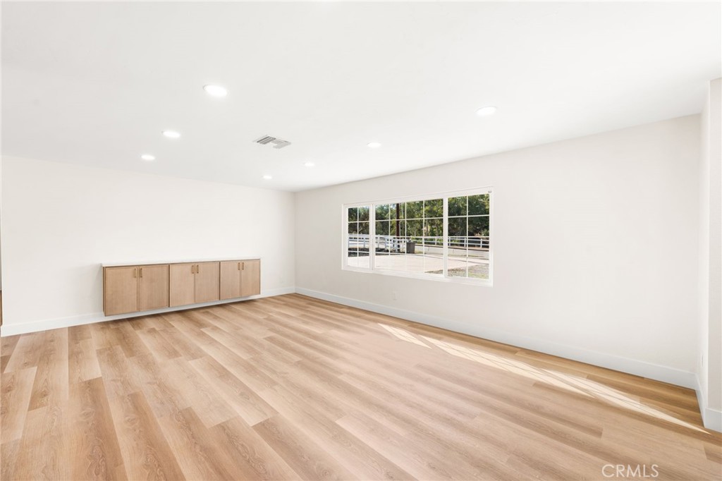 2060 South Grade Road Alpine, CA 91901 - Photo 5 of 69 a view of an empty room with wooden floor and a window