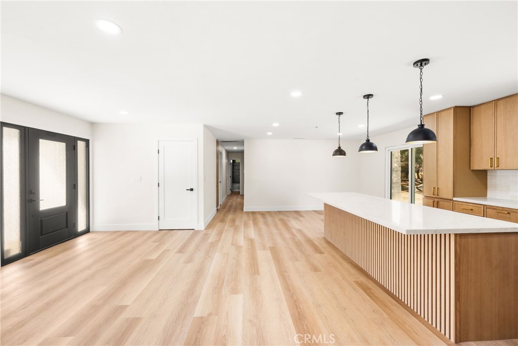 2060 South Grade Road Alpine, CA 91901 - Photo 10 of 69 a spacious bedroom with a bed and a chandelier