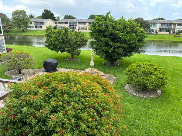a view of a lake with a house in the background
