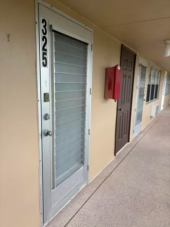 a view of a closet area with entryway