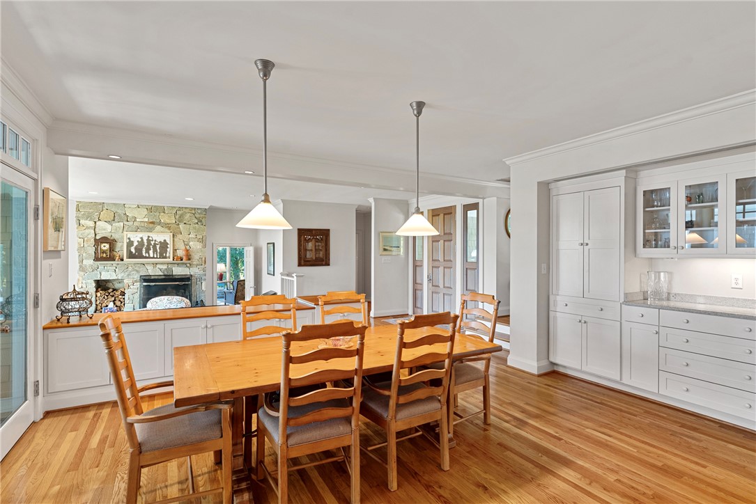 1976 Custis Millpond Road West Point, VA 23181 - Photo 23 of 50 a dining room with furniture a chandelier and wooden floor