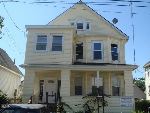 198 Adams Street Bridgeport, CT 06607 - Photo 1 of 1 a front view of a house with balcony