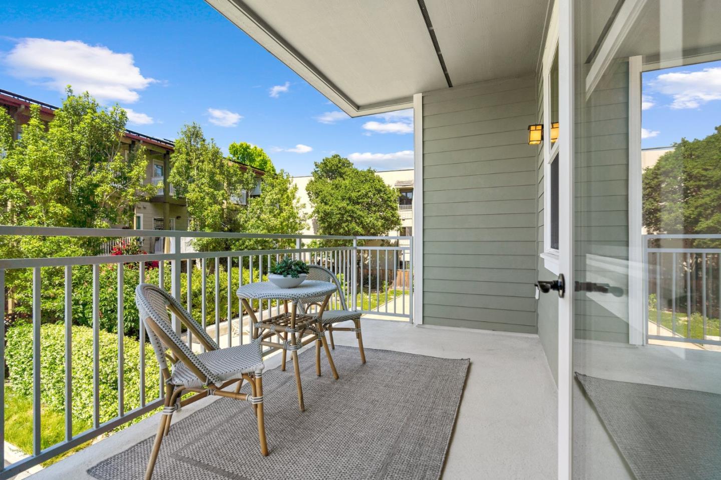 708 Frederick Street, Unit 204 Santa Cruz, CA 95062 - Photo 16 of 28 a balcony with table and chairs