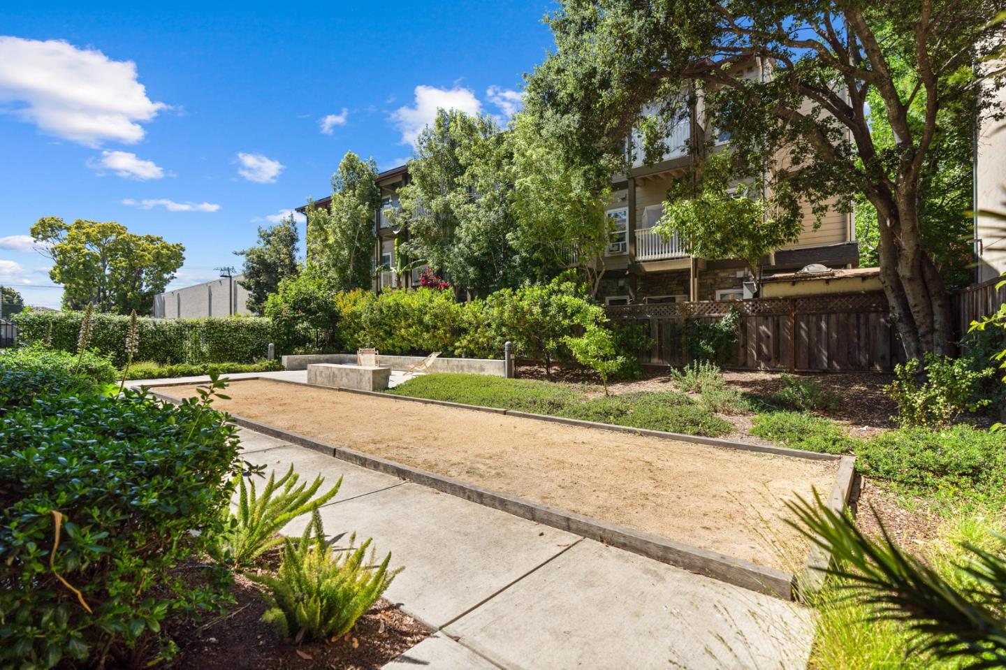 708 Frederick Street, Unit 204 Santa Cruz, CA 95062 - Photo 19 of 28 a view of yard with swimming pool and trees in the background