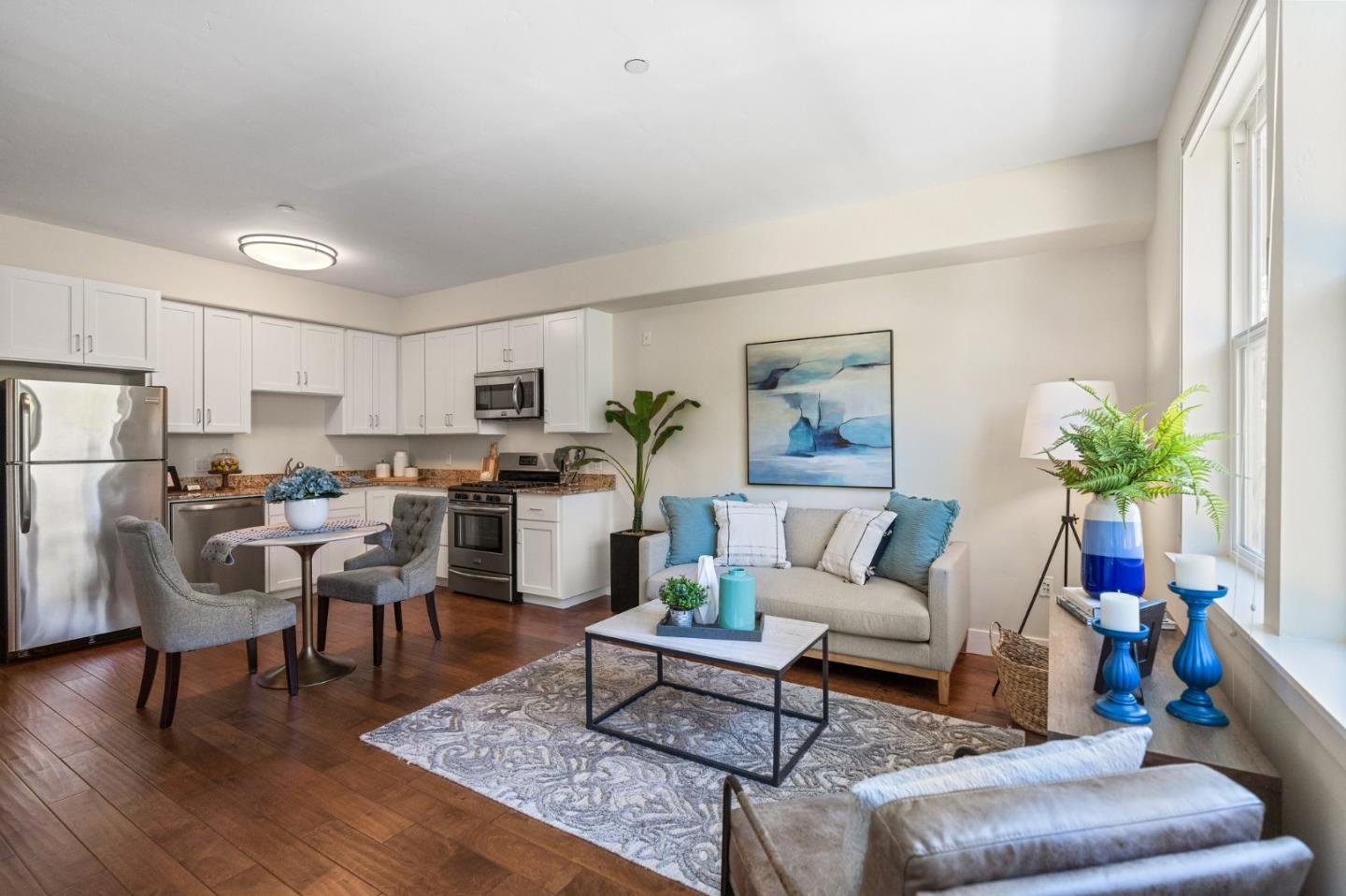 708 Frederick Street, Unit 204 Santa Cruz, CA 95062 - Photo 2 of 28 a living room with furniture kitchen view and a refrigerator