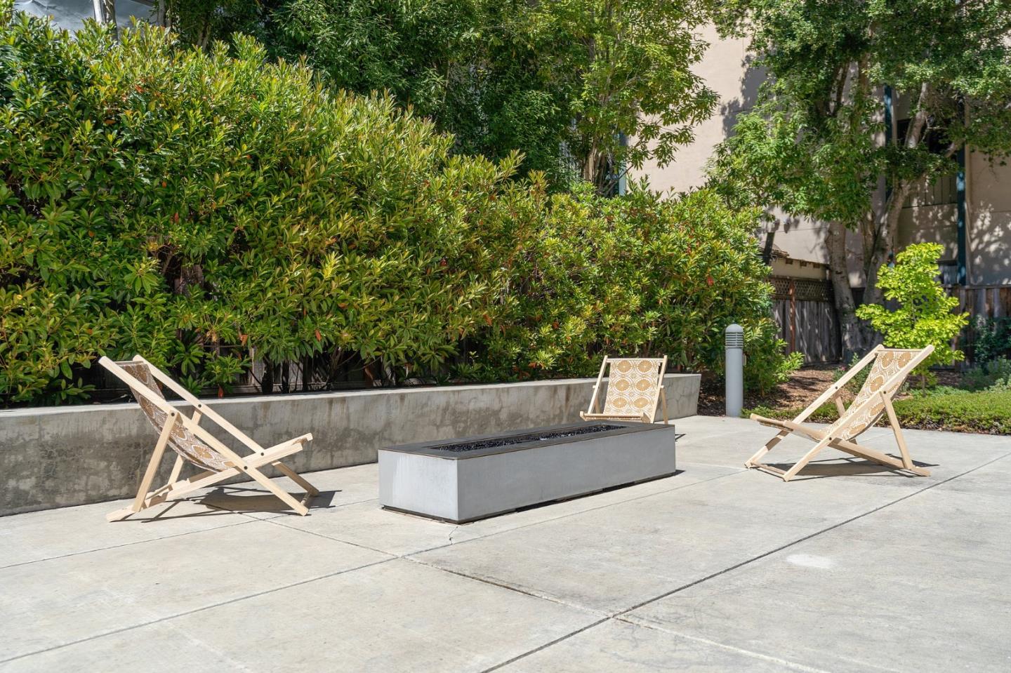 708 Frederick Street, Unit 204 Santa Cruz, CA 95062 - Photo 21 of 28 a view of a lounge chairs in the patio